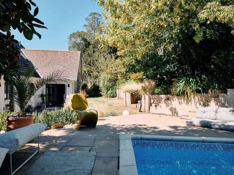 The pool, the yellow chair and the house