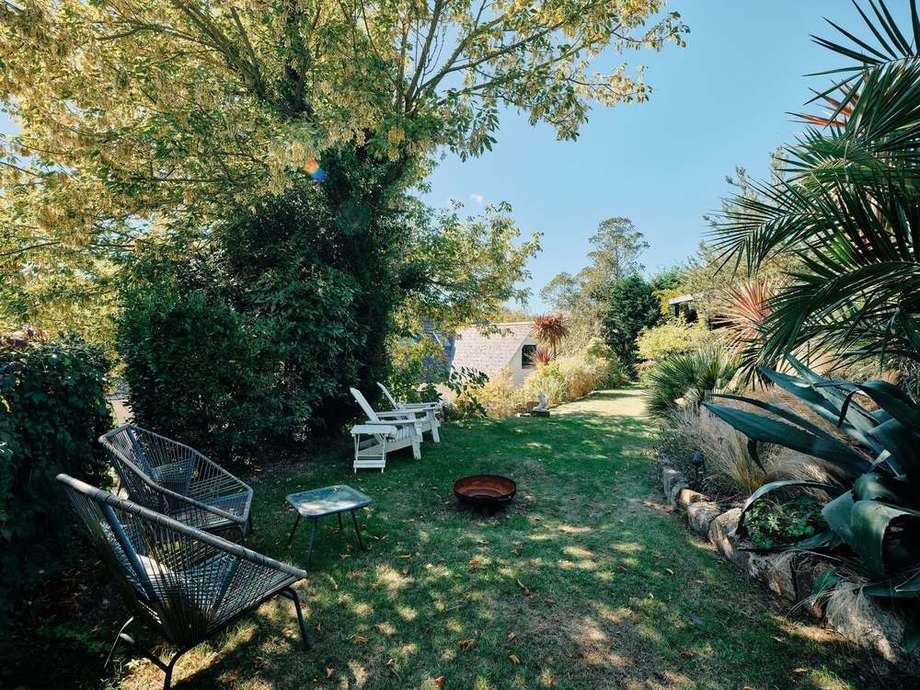 Garden chairs in the shade of the trees
